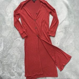 Rust colored cardigan w a few button in front